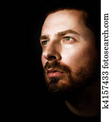 Hopeful man looking into the light