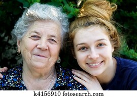 Young woman hugging her grandmother