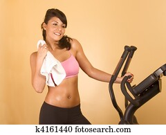 Attractive female is sweaty after cardio workout