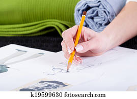 Fashion designer sketching clothes project