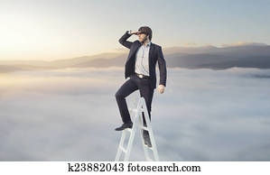 Ambitious businessman looking for his target Ambitious businessman looking for his target