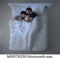 Couple sleeping and hugging