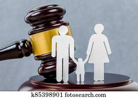 Family figure and gavel on table. Family figure and gavel on table.