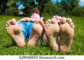 Family lying on the grass Family lying on the grass