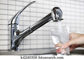 Filling glass of tap water Filling glass of tap water