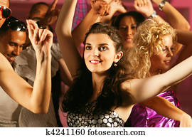 Friends dancing in club or disco