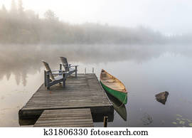 Green Canoe and Dock on a Misty Morning Green Canoe and Dock on a Misty Morning
