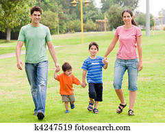 Happy family walking in the park
