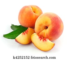 fresh peach fruits with green leaves