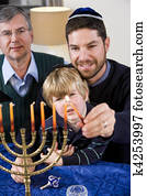 Jewish family lighting Chanukah menorah Jewish family lighting Chanukah menorah