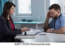 Lawyer in doctor's office