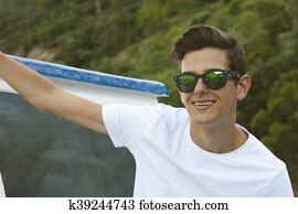 portrait of young man wearing sunglasses outdoors portrait of young man wearing sunglasses outdoors