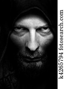 Dark portrait of scary evil sinister man Dark portrait of scary evil sinister man
