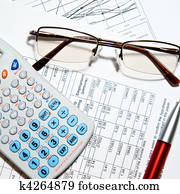 Financial report - calculator, glasses and papers Financial report - calculator, glasses and papers