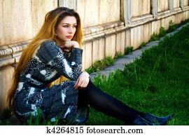 Solitude - sad pensive woman sitting alone