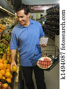 Man grocery shopping.