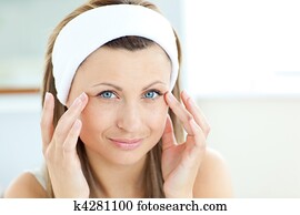 young woman touching her wrinkles