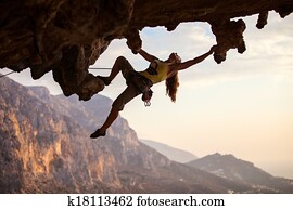 Rock climber at sunset Rock climber at sunset