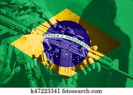 Soldier with machine gun with national flag of Brasil Soldier with machine gun with national flag of Brasil
