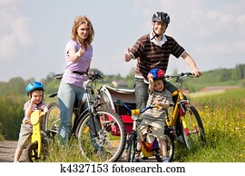 Family riding bicycles in summer Family riding bicycles in summer