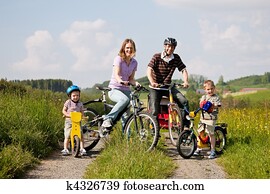 Family riding bicycles in summer Family riding bicycles in summer