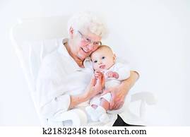  grandmother singing to her newborn baby grandson sitti