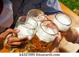 Group of four friends drinking beer