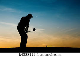 Senior male golf player at sunset Senior male golf player at sunset