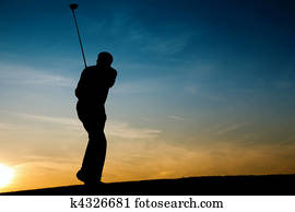 Senior male golf player at sunset Senior male golf player at sunset