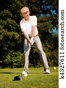 Senior player golf teeing Senior player golf teeing