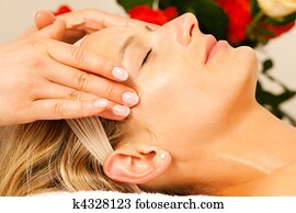 Woman enjoying wellness head massage