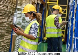 African black warehouse worker do inventory.
