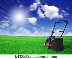 Lawn mower on green field Lawn mower on green field