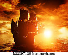 Ancient pirate ship sailing on the ocean at sunset Ancient pirate ship sailing on the ocean at sunset