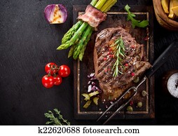 Beef steak on wooden table Beef steak on wooden table