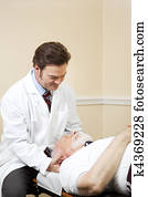 Chiropractor Adjusts Neck Chiropractor Adjusts Neck