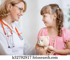 Pediatrician doctor talking with kid Pediatrician doctor talking with kid