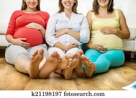 Pregnant women on sofa