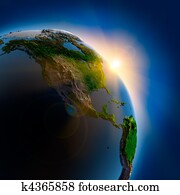 Sunrise over the Earth in outer space