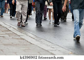 Crowd walking - group of people walking together (motion blur) Crowd walking - group of people walking together (motion blur)