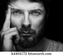 Face of handsome bearded confident man