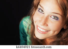 Face of happy joyful young friendly woman