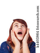 Isolated amazed young woman looking up