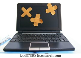 laptop computer with bandages - computer repair, or online healthcare concept laptop computer with bandages - computer repair, or online healthcare concept