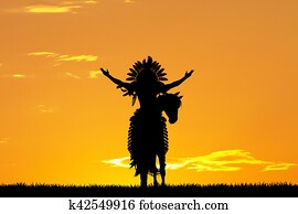 Native American Indian on horseback at sunset Native American Indian on horseback at sunset