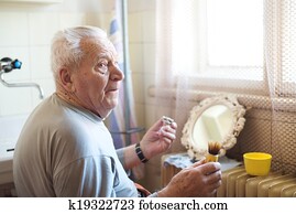 Senior man shaving Senior man shaving