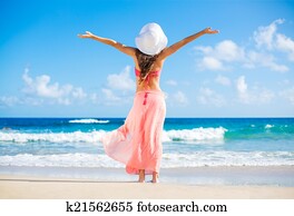 Happy woman at the beach