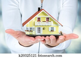house in woman hands - real estate 