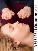 Woman in reiki healing session