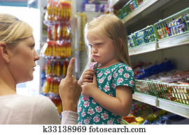 Child Having Arguement With Mother At Candy Counter Child Having Arguement With Mother At Candy Counter